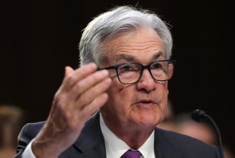 Jerome Powell says Fed will likely speed up interest rate hikes if the economy keeps roaring